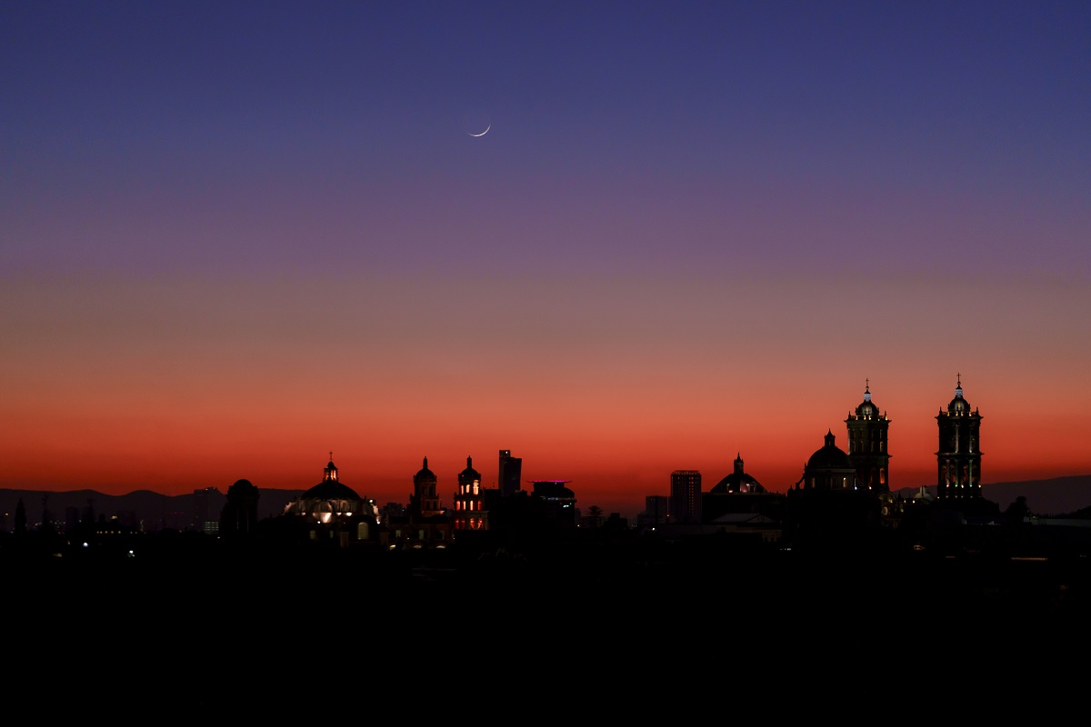 Crescent moon above Puebla skyline at sunset, captured from Banyan Tree Puebla.